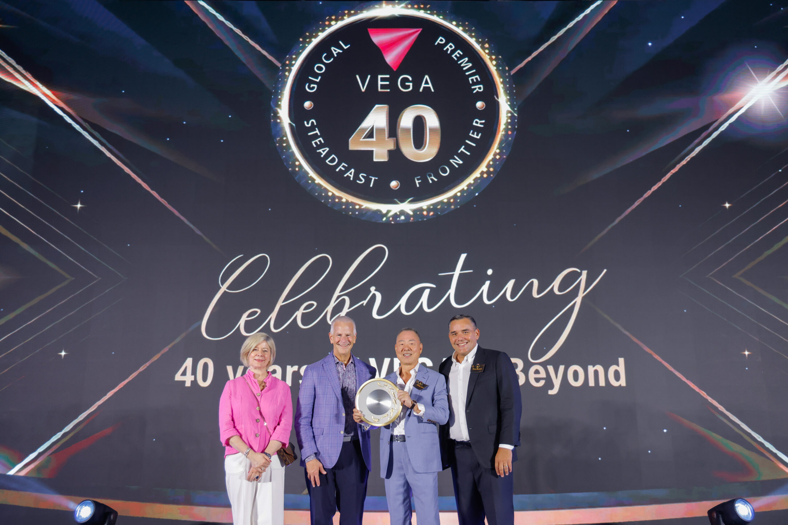VEGA Founder Laurie Chow and CEO Steve Medeiros Receiving AVIXA Commemorative Gift at The Athenee Hotel